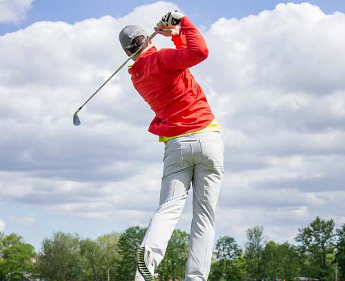 human man in red long-sleeved top golf golf