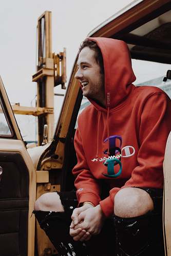human man sitting inside car person