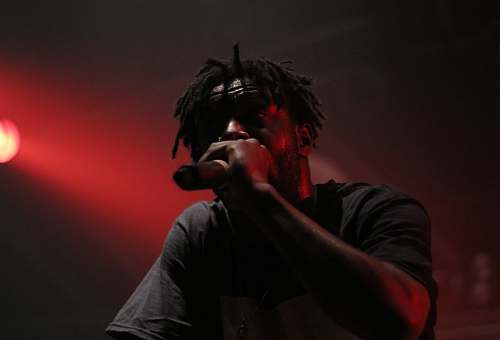 human person holding mic singing person