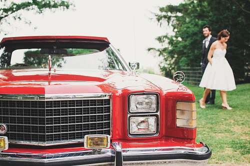 people close up photo of red vehicle car
