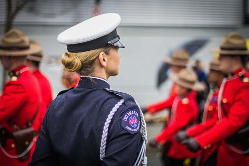human focus photo of woman in black top wearing white and black hat people