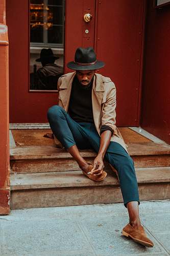 human man sitting on staircase people