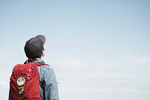 people man staring at white sky taken at daytime human