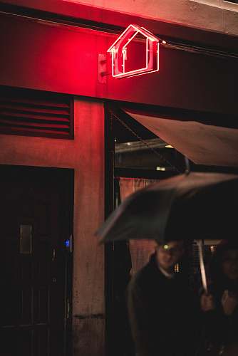 human man under black umbrella london