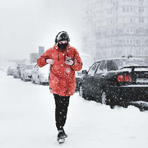 people man walking on snowy road snow