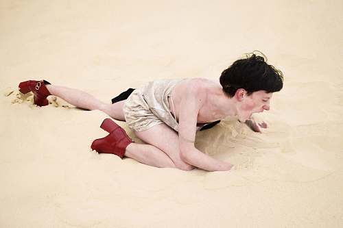 human person crawling on sand people