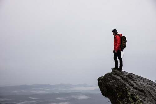 people person standing on gray rock human