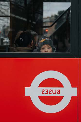 human photo of child riding in bus people