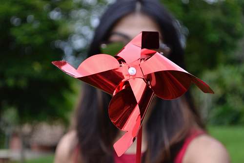 human selective focus photography of red paper mill people