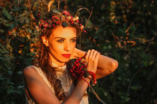 woman selective focus photography of woman with berry crown on her head human