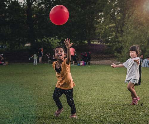 human two girls playing balloon people