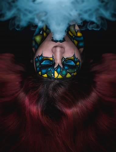 human woman blowing smoke people