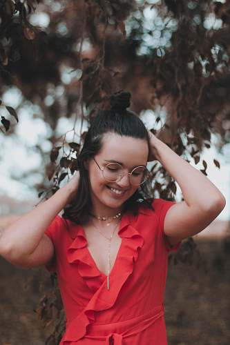 human woman putting both hands his hair people