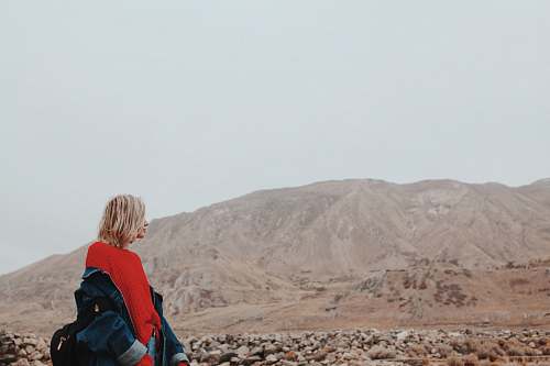 human woman standing carrying jacket people