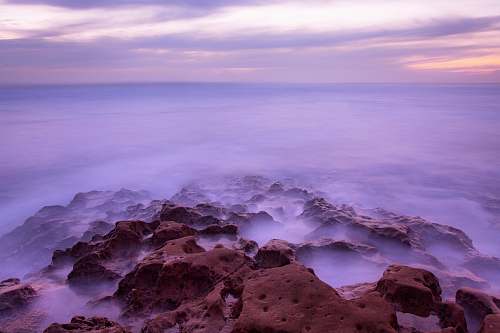 rocks landscape photography of rock with clouds rock