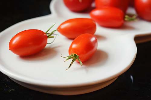 food cherry tomatoes on white plate tomato