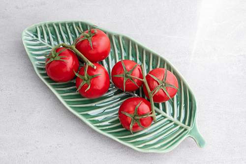 dish tomatoes on green leaf plate meal