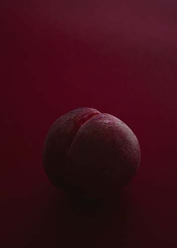 fruit brown ball on red surface food