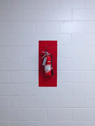 or red fire extinguisher on wall usa