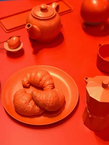 saucer croissants on plate candle
