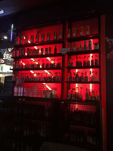 helsinki pile of liquor bottles in cabinet bar counter