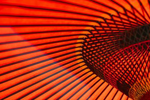 japan An abstract photo of orange neon lines and rails along the walls in an Asakusa building orange