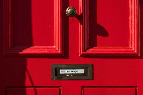 london closed red wooden door united kingdom