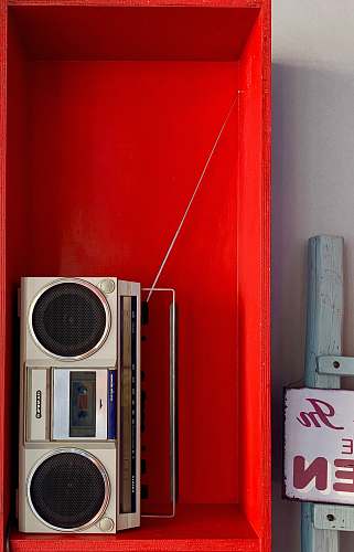 electronics grey and white boom box in shelf speaker