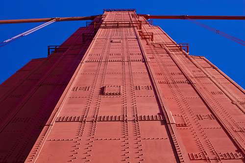 building low-angle photography of red metal tower architecture