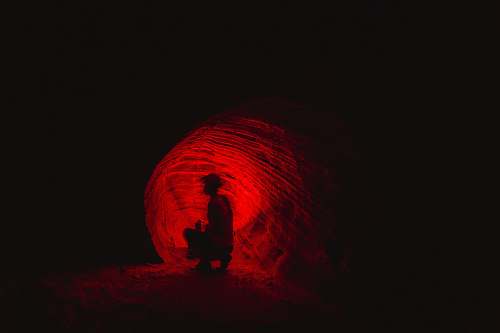 silhouette man in cave cave