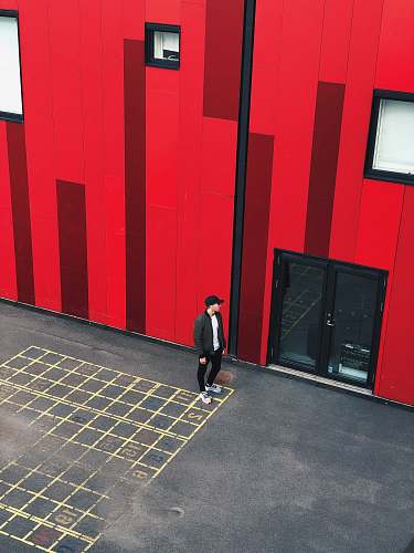 building man standing near full-glass door denmark