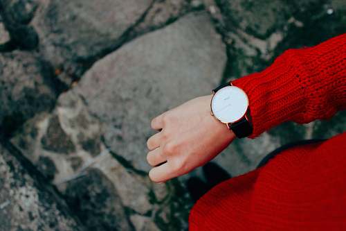 sweater person wearing red sweater and watch jumper