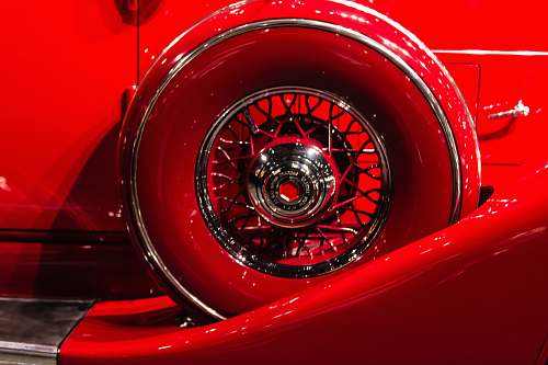 tire photo of a red vehicle wheel and tire set wheel