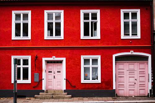 window pink wooden double doors are closed sweden