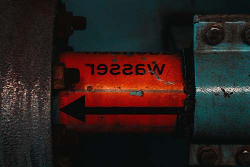machine red and black metal signage water