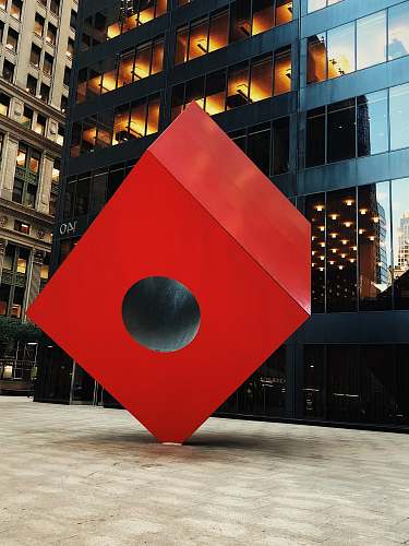 sphere red box decor near building road sign
