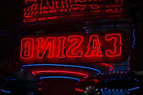 light red Casino neon sign turned on neon