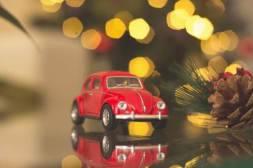 car red Volkswagen car die-cast model on table christmas