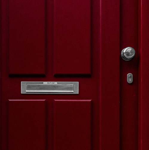 door red wooden door with mail box letterbox