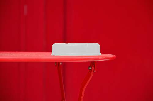 chair round white plastic container on red table furniture