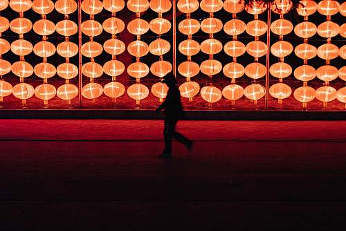 dalian silhouette of person walking near lantern lamp china