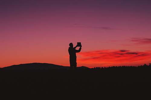 asilah silhouette photo of man on hill morocco