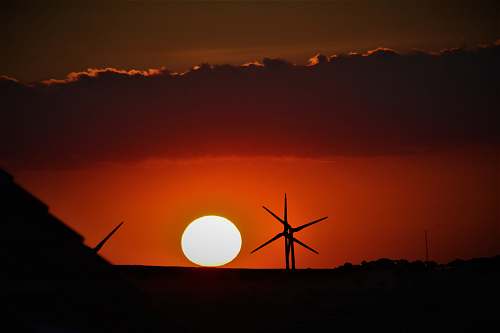 sunset windmill at golden hour sky
