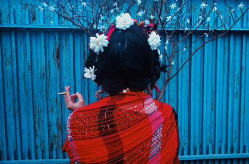 flowers woman smoking outdoors blue
