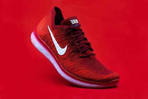 footwear unpaired red Nike sneaker apparel