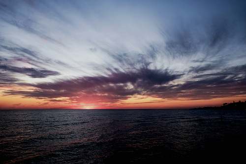 clouds ocean under gloomy sky during golden hour australia