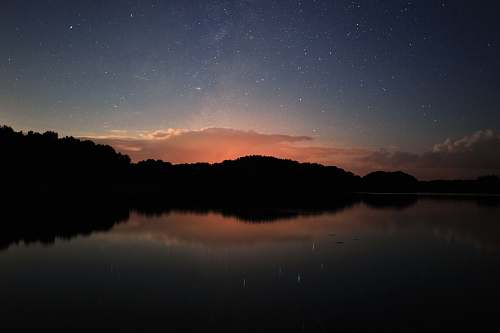 nature reflection photo of trees lake