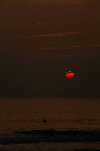 nature red sunset over a beach outdoors