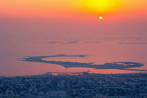 sky seaside city during sunset sunrise