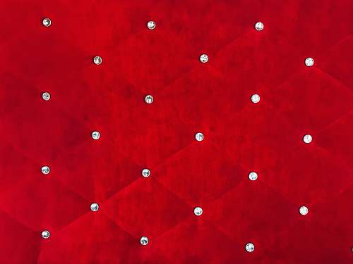 red quilted red textile diamons